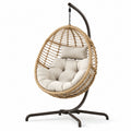 Fauteuil suspendu en rotin synthétique avec coussin beige et cadre en métal